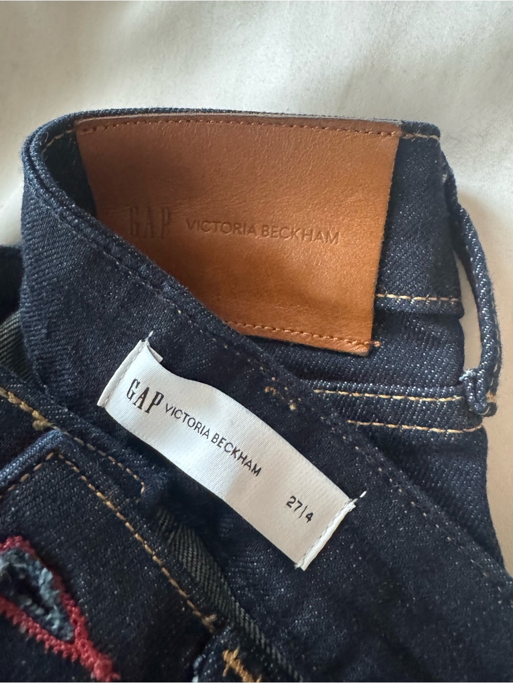 Victoria Beckham Men’s Dark Blue Denim Jeans with Tan Patch